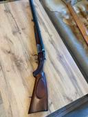 Review of the Simson Suhl Triple-Barrel Shotgun (Caliber 12/70, 12/70, 6.5/57R) - Made in GDR

The Simson Suhl triple-barrel shotgun is a unique piece of firearm engineering that deserves careful consideration from both collectors and shooters alike. Manufactured in the German Democratic Republic (GDR), this shotgun showcases the craftsmanship and hunting culture that thrived in that era. Here's my detailed review based on my experience with this firearm.

Build Quality and Design

First impressions of the Simson Suhl shotgun are striking. The intricate craftsmanship and attention to detail in the design immediately stand out. The barrels exhibit a beautifully polished finish that not only enhances aesthetics but also works to prevent corrosion. The action is robust, with each barrel seamlessly integrated into the design. 

The triple-barrel configuration, featuring two 12/70 barrels and one 6.5/57R, offers versatility on the field. This unique setup makes the shotgun a suitable choice for both shotgun and rifle shooting sports. The 12-gauge barrels are ideal for various shooting applications, such as game hunting and clay shooting, while the 6.5mm barrel allows for precision shooting at longer ranges.

Performance

In terms of performance, the Simson Suhl delivers reliably and efficiently. The kick of the 12/70 cartridges can be significant for some, but with proper technique, it can be managed comfortably. The shotgun cycles smoothly between shots, making follow-up shots quicker during practical shooting scenarios.

The accuracy of the 6.5mm barrel is commendable, accommodating both target shooting and taking down medium-sized game effectively. I found that with the right ammunition, the ballistic performance is competitive with other rifles in the same caliber. 

Handling

Handling the Simson Suhl  is an enjoyable experience. The balance is impressive; it feels well-weighted in the hands, allowing for quick target acquisition. The trigger pull is crisp, a factor that greatly enhances shooting accuracy. However, the weight of the gun may be a consideration for long days in the field, as it can become tiresome over extended periods.

Cultural and Historical Value Simson Suhl Triple-Barrel Shotgun 

Owning a piece of GDR history is not only about functionality but also about the story that accompanies the firearm. Simson Suhl has a rich legacy, and this shotgun reflects the quality and dedication to craftsmanship from that period. For collectors, this model is an excellent addition due to its historical significance and distinctive design.

Conclusion

To conclude, the Simson Suhl triple-barrel shotgun in 12/70 and 6.5/57R offers a remarkable blend of craftsmanship, performance, and historical charm. While it may not be the most practical choice for everyone due to its weight and complexity, it is undoubtedly a standout option for those who appreciate unique firearms and desire versatility in their shooting experiences.