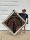 Here it is with the frame! Gavin was so excited to get this feather frame back, his dad did the woodwork in the frame. 🔥