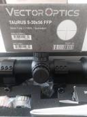 Review of the Taurus 5-30x56 FFP Optic from Vector Optics

The Taurus 5-30x56 FFP (First Focal Plane) from Vector Optics is a high-performance riflescope designed for precision shooting at long ranges. With its robust features and quality build, this optic is aimed at both serious enthusiasts and competitive shooters looking to enhance their shooting experience. Here’s a detailed overview of its performance, features, and overall value.

Build Quality and Design Taurus 5-30x56 FFP

One of the first things that stands out about the Taurus 5-30x56 is its solid construction. The scope is built from aircraft-grade aluminum, making it both lightweight and incredibly durable. The matte black finish is not only aesthetically pleasing but also provides a non-reflective surface that minimizes glare.

The scope is designed to be water, fog, and shock-proof, ensuring that it can withstand harsh environmental conditions. This durability is essential for outdoor shooting, whether in wet or tough terrains.

Magnification and Optics Taurus 5-30x56 FFP

The 5-30x magnification range is highly versatile, allowing shooters to engage targets at various distances with ease. The large 56mm objective lens gathers plenty of light, which is especially beneficial for low-light shooting scenarios. The clarity and brightness of the image through the scope are impressive, with minimal distortion or color shift at higher magnifications.

The first focal plane reticle is a significant advantage, as it allows for accurate holdovers and windage adjustments at any magnification level. This is particularly useful for long-range shooting, where precision is critical.

Reticle Options Taurus 5-30x56 FFP

Vector Optics offers a range of reticle options for the Taurus 5-30x56, catering to different shooting preferences. The reticles are well-defined and easy to read, with illumination options that enhance visibility in dim conditions. Adjusting the illumination is straightforward, allowing for quick adaptations during changing light situations.

Turret Adjustments Taurus 5-30x56 FFP

The turret adjustments are tactile and provide positive clicks, which is crucial for making precise elevation and windage corrections. The adjustments hold zero well, and the return to zero feature allows for quick re-zeroing if needed.

Performance in Real Use Taurus 5-30x56 FFP

During testing, the Taurus 5-30x56 performed admirably. The scope maintained a clear point of view even at the maximum magnification, and shooting groups at extended ranges showed consistent accuracy. The eye relief is comfortable, allowing for quick target acquisition and reducing the chances of the dreaded ‘scope bite.’

Value for Money Taurus 5-30x56 FFP

In terms of pricing, the Taurus 5-30x56 is competitively positioned within the high-end riflescope market. Given its features and performance, it represents good value for those who prioritize quality optics without breaking the bank.